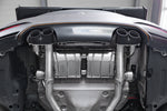 Close-up of Capristo black ceramic quad tips installed on a BMW M4