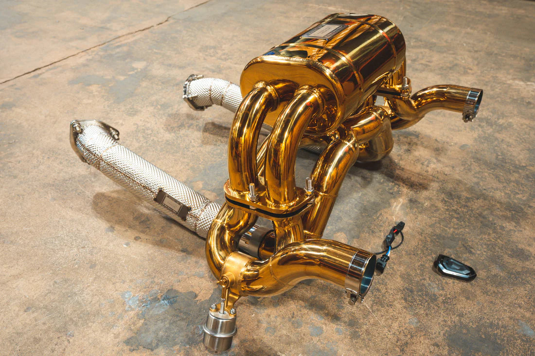 A side overview of Valvetronic Designs Valved Sport exhaust system on the ground (for Ferrari F430 Scuderia / 16M).