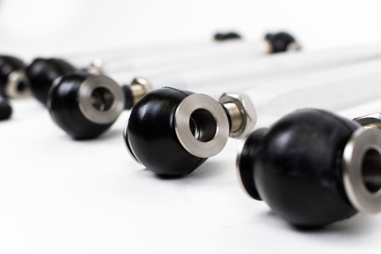 Row of black Heim joint ends on the rear links - 4-Link Rear Suspension Upgrade for the 1990-2002 SL 320 / SL 500 / SL 600