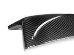 A close up view of AUTOTECKNIC M-INSPIRED DRY CARBON MIRROR COVERS - BMW G01 X3 | G02 X4 | G05 X5 | G06 X6 | G07 X7 2017+ with white background