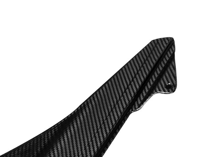 A close up view of AUTOTECKNIC DRY CARBON SIDE SKIRT WINGLET SET - BMW F87 M2, Competition, CS 2016+ with white background