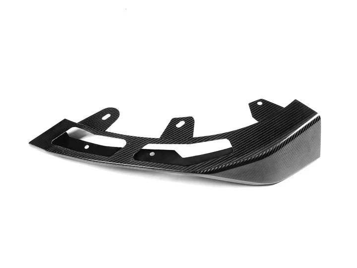 A close up view of AUTOTECKNIC DRY CARBON PERFORMANTE FRONT AERO LIP - BMW G42 2-SERIES M-SPORT 2022+ with white background