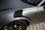 A side view of TECHART Air Outlet panels in Carbon "glossy" for Porsche 991.1 GT3 RS fitted on a grey Porsche