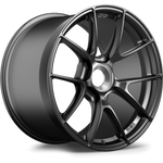 Single automotive wheel with dark gunmetal finish, multi-spoke design, and silver center hub on white background - APEX Wheels wheel for 19x12 ET63 PSCL - Satin Black