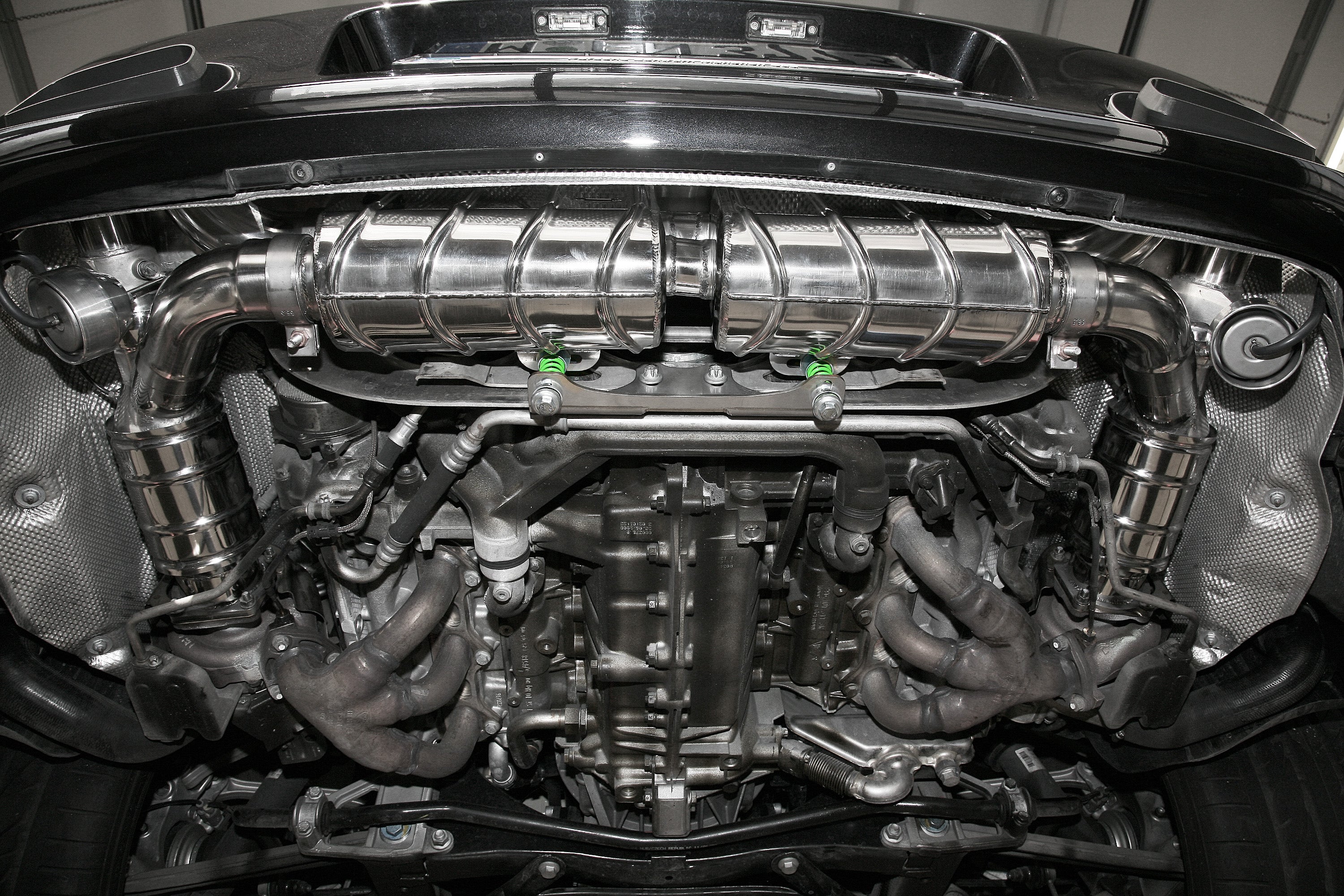 Capristo exhaust installed under a Porsche 997 Turbo, view of mufflers and turbos