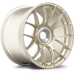 Gold-colored forged aluminum wheel with multi-spoke design, central hub bore, and curved spokes on clean white background - APEX Wheels wheel for 19x12 ET46 PSCL - Motorsport Gold