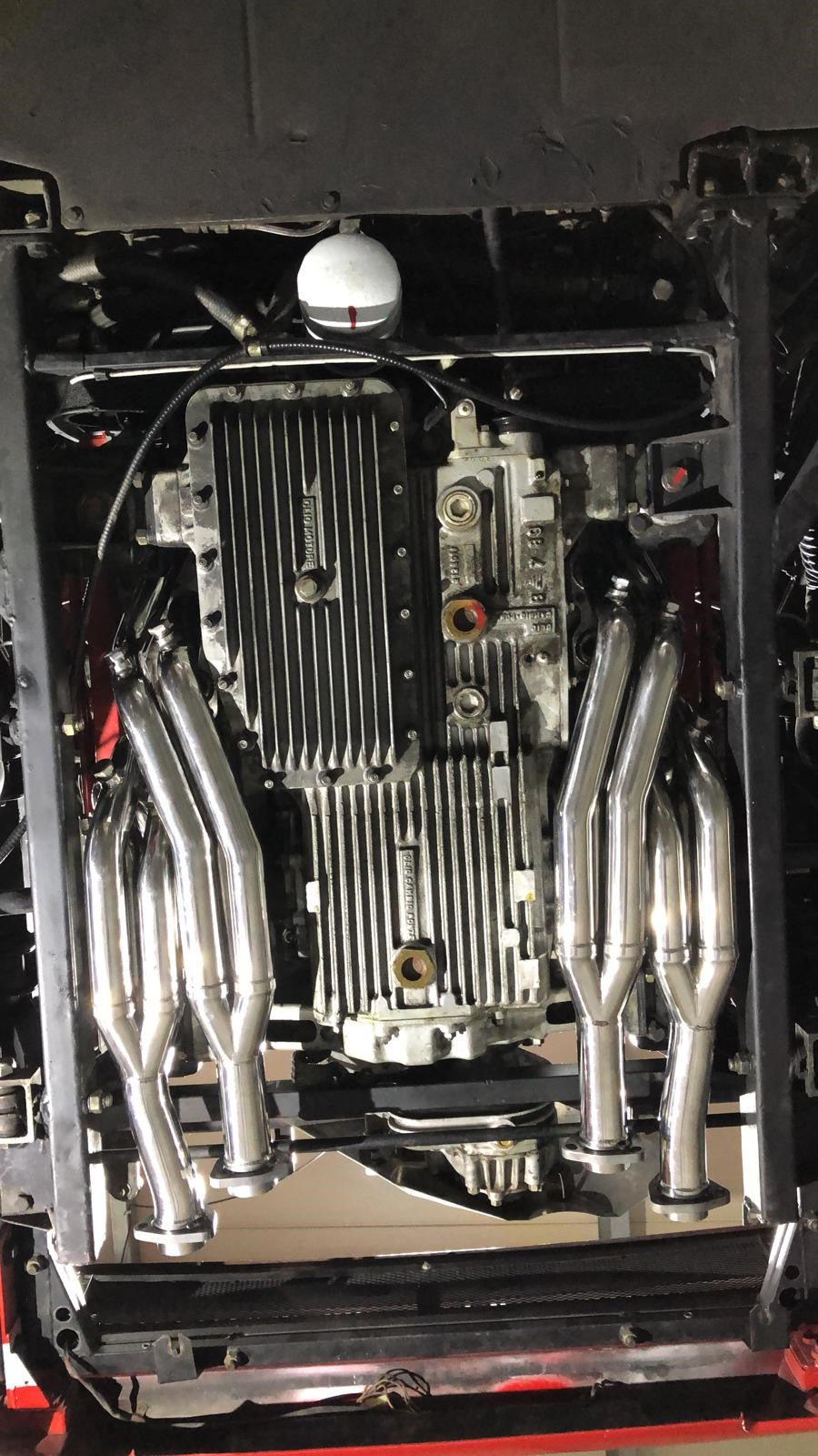 Capristo headers installed under a Ferrari Testarossa flat-12 engine
