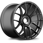Dark gunmetal forged wheel with multi-spoke design and wide barrel profile on white background - APEX Wheels wheel for 19x12 ET46 PSCL - Satin Black