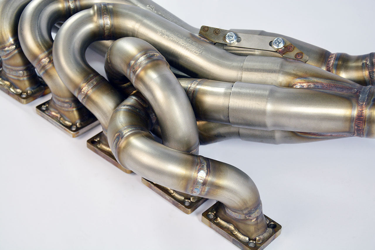 close top view of Supersprint Manifold 100% Stainless steel "Step Design" (Left Hand Drive) for BMW E24 M 635CSi 1984-2005 with white background