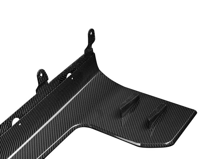 A close up view of AUTOTECKNIC DRY CARBON SIDE SKIRT WINGLET SET - BMW G87 M2 2023+ with white background