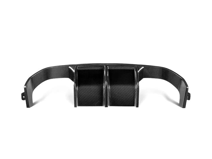 A close up view of AUTOTECKNIC DRY CARBON VERSUS REAR DIFFUSER SET - BMW F80 M3 | F82/ F83 M4 2014+ with white background