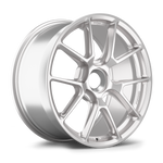 Silver alloy wheel with multi-spoke design, machined finish, center hub bore, positioned at angle on white background - APEX Wheels wheel for 19x9.5 ET50 PSCL - Race Silver