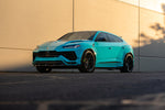 Teal Lamborghini Urus S with the Urban Widetrack program, front three-quarter view