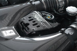 Close-up of Capristo carbon lock cover in a Ferrari 458 Speciale engine bay