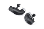 Two curved carbon fiber turbo inlets with metal couplers and black fittings on white background - Eventuri turbo inlet for BMW G90 G99 M5