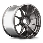 Gunmetal gray forged wheel with ten split spokes displayed at three-quarter angle on white background - APEX Wheels wheel for 19x12 ET46 PSCL - Anthracite