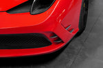 Capristo carbon fiber front fins on a red Ferrari 458 Speciale bumper