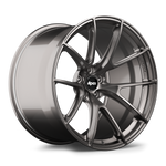 Gunmetal grey forged aluminum wheel with ten-spoke design and center cap, positioned at three-quarter angle showing face and barrel - APEX Wheels wheel for 21x13 ET22 5x120 - Anthracite