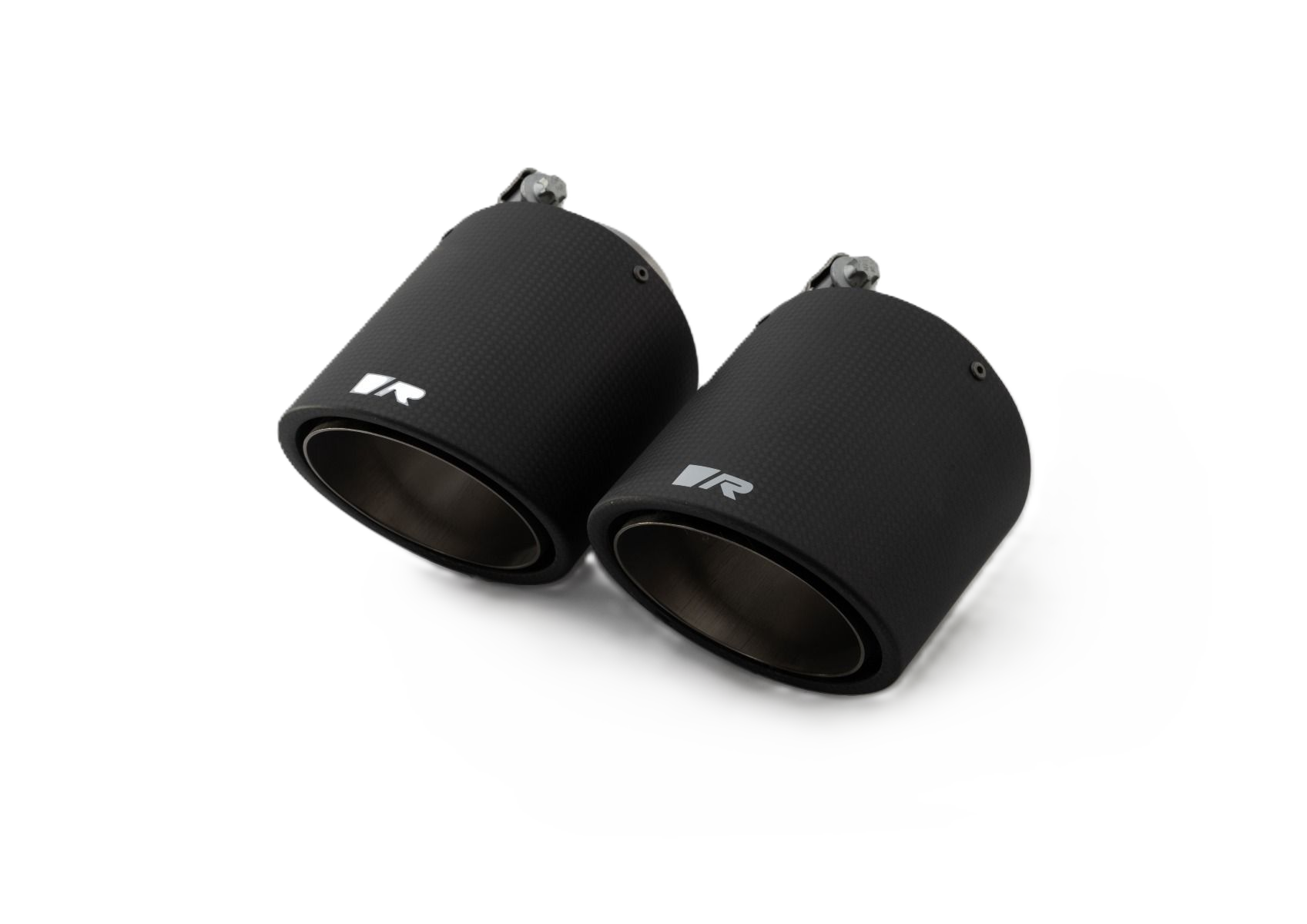 Pair of black carbon angled tail pipes, dark backdrop, Carbon Angled 102mm tips for the Remus G87 M2 Sport Axle-Back Exhaust