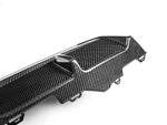 A close up side view of AUTOTECKNIC DRY CARBON PERFORMANTE REAR DIFFUSER - BMW G42 2-SERIES M-SPORT 2022+ with white background