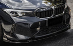 A close up view of AUTOTECKNIC DRY CARBON PERFORMANTE FRONT SPLITTER SET - BMW G20 3-SERIES M-SPORT LCI 2022+ fitted on a car