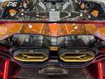 IPE exhaust with gold-wrapped muffler installed on a Lamborghini Revuelto