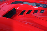 Vent openings in the Capristo Ferrari 458 Spider bonnet on a red car