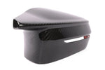 A side view of DINAN MIRROR COVER SET BMW M3/M4 2021-2024 with white background