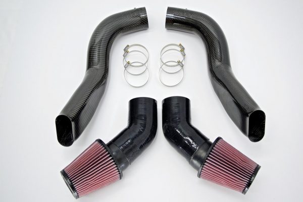A top view of RK Autowerks F1X M5 M6 CARBON FIBER INTAKES parts with a white background
