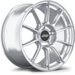 Silver forged wheel with ten-spoke design and center cap shown at three-quarter angle on white background - APEX Wheels wheel for 18x9 ET46 5x130 - Brushed Clear