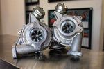 A front wide view of Pure Turbos Turbo Upgrade PURE800 for Ferrari sitting on a brown table