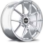 Silver alloy wheel with ten-spoke design and black center cap, showing brushed metal finish and five bolt holes - APEX Wheels wheel for 20x9 ET50 5x130 - Brushed Clear