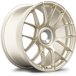 Matte gold forged wheel with curved Y-spoke design and center hub, positioned at three-quarter angle on white background - APEX Wheels wheel for 19x11 ET48 PSCL - Motorsport Gold