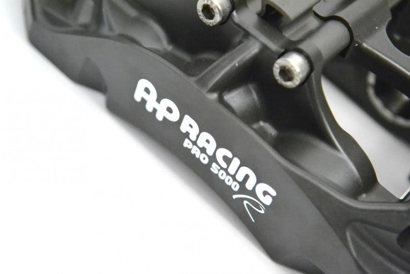 A close up view of CP9660 of the AP Racing by Essex Radi-CAL Competition Brake Kit (Front CP9660/372mm) - Subaru WRX and STI with white background