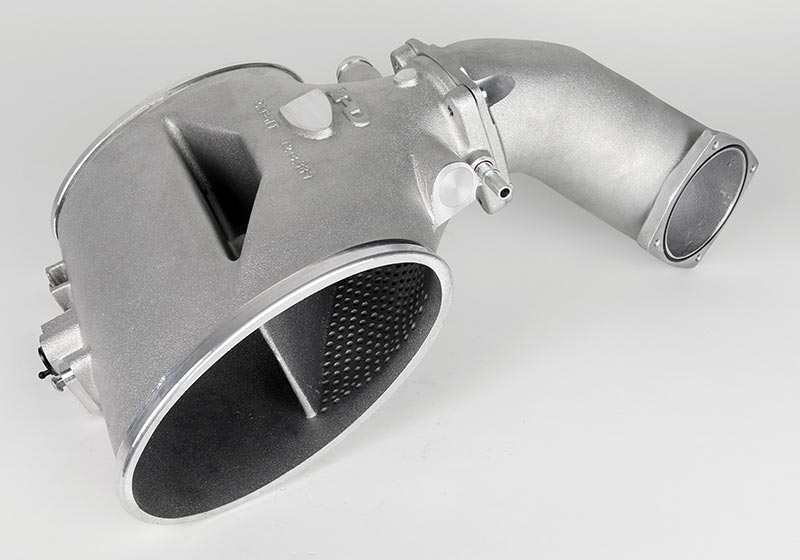 Direct-injection IPD plenum with cast throttle body elbow attached, showing oval inlet and internal divider - IPD for Porsche 987.2 Boxster