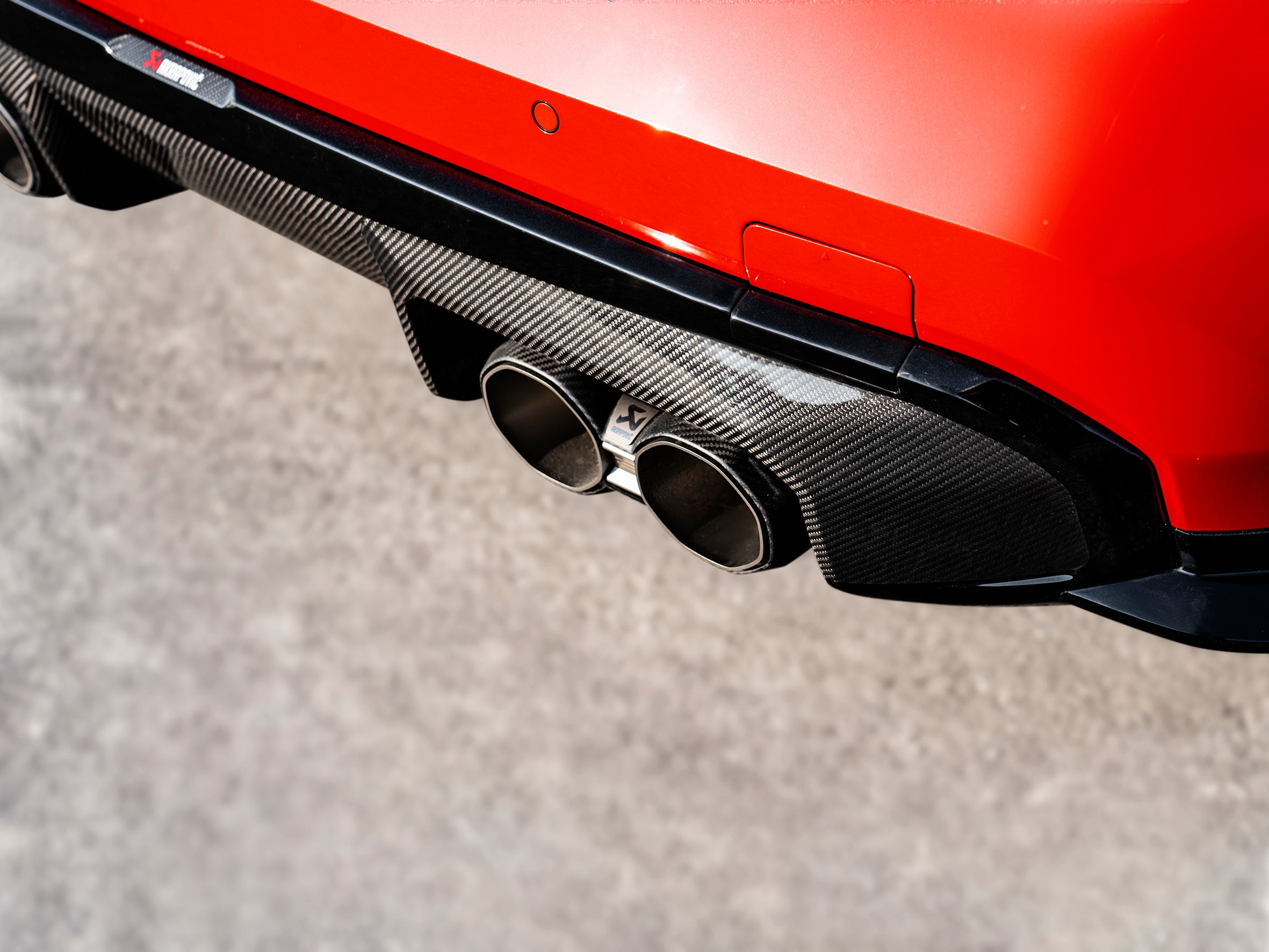 Akrapovic Rear Carbon Fibre Diffuser - High Gloss Black DI-BM/CA/9/GB for BMW M4 (G82/G83) 2021-2026, detail view