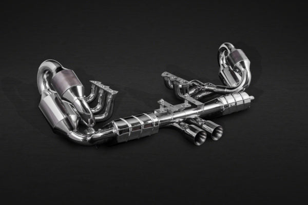 wide front view of Capristo Racing Valved Exhaust with Headers, 250 Cell Sports Cat, and Carbon Engine Cover (CES3) For Porsche 991.1 GT3/3RS 2013-2017 with black background