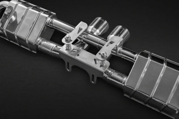 close front view of Capristo Racing Valved Exhaust with Headers, 250 Cell Sports Cat, and Carbon Engine Cover (CES3) For Porsche 991.1 GT3/3RS 2013-2017 with black background