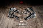 A top view of Fi EXHAUST Valvetronic Cat-Back System for Porsche 991.1 GT3 / RS 2013-2019 header on a wooden floor