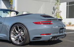 A back side view of TECHART Rear Bumper Air Outlet Trim Porsche 991.2 Carrera / Targa fitted on a grey car