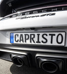 Close-up of black oval tailpipes on Porsche 992.2 Carrera GTS