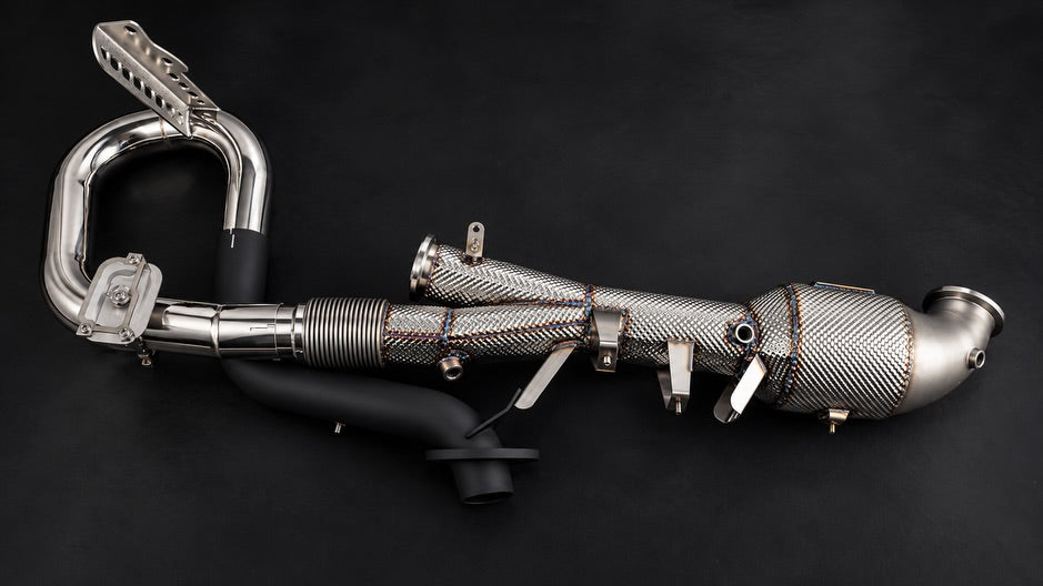 Capristo 992.2 GTS exhaust section showing sport catalyst, flex joint and OE actuator bracket