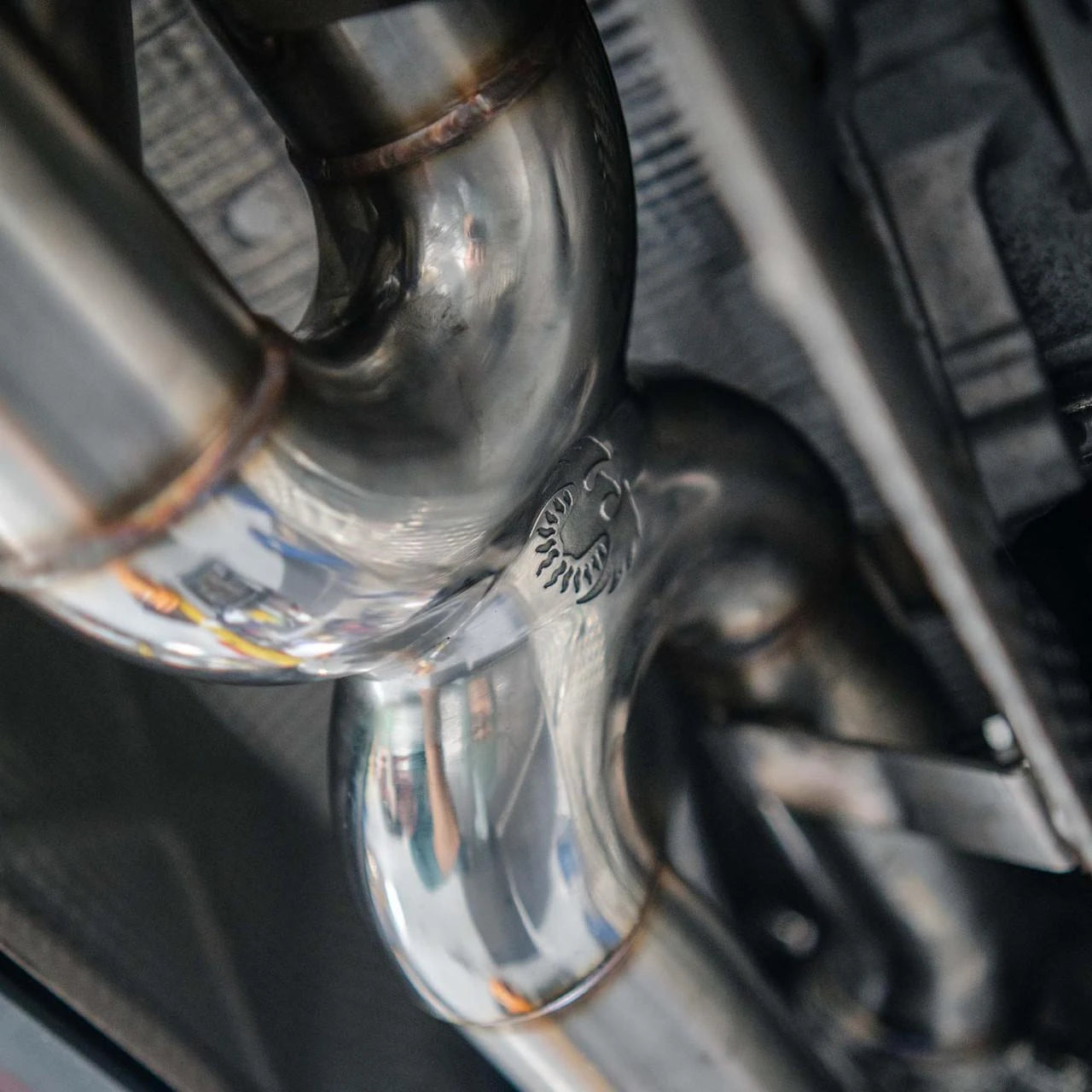 Installed 992.2 Carrera valved Maxflo exhaust pipe routing