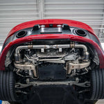 Red Porsche 992.2 Carrera on a lift with the sport cats fitted