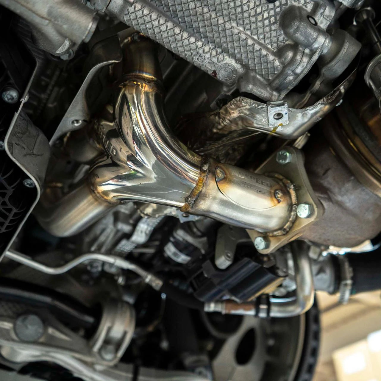 992 Turbo S sport header installed beside the engine