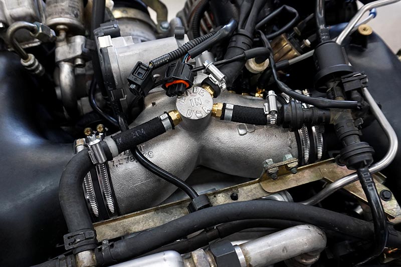 IPD plenum installed on a 996 Turbo engine with vacuum lines connected to the brass fittings - IPD for Porsche 996 Turbo