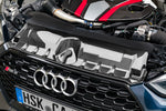 Capristo carbon lock cover above the grille of a blue Audi RS5 F5