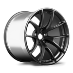 Black forged alloy wheel with curved spoke design and polished silver barrel on white background - APEX Wheels wheel for 19x12.25 ET18 5x120 - Satin Black