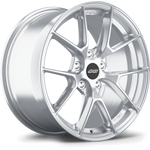 Silver aluminum alloy wheel with multi-spoke design and black center cap on white background - APEX Wheels wheel for 17x9 ET61 5x114.3 - Brushed Clear