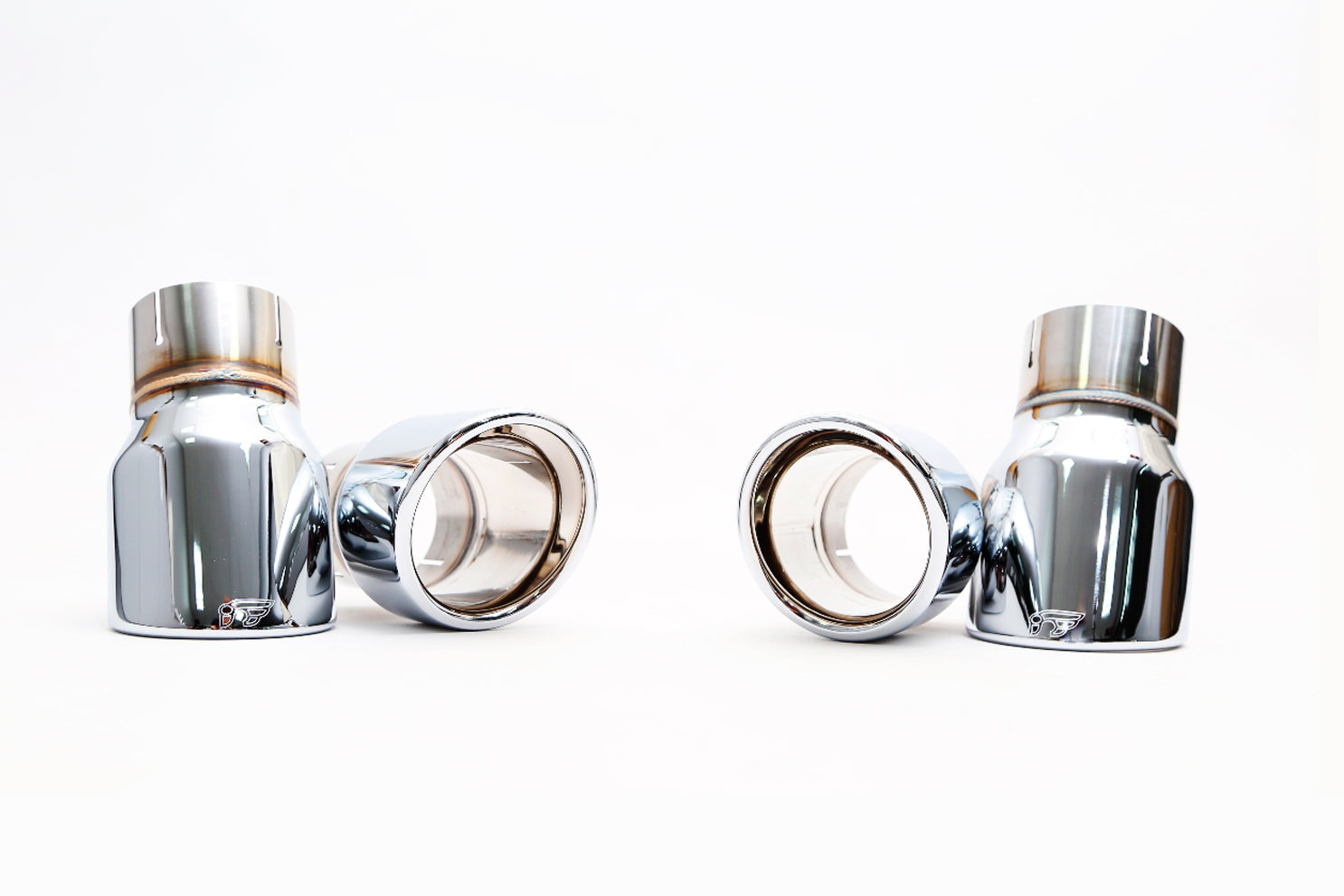 A front view of the Quad chrome silver tips of the IPE SS Cat-Back Exhaust System with Remote Control for Audi A6 / A7 C7 3.0 TFSI Quattro 2010-2017 on a white background